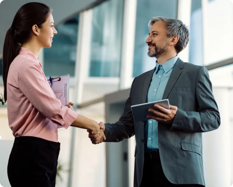 A Bezit partner shaking hands with a client